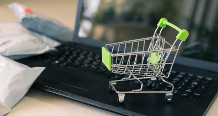 Package with a shopping cart and laptop